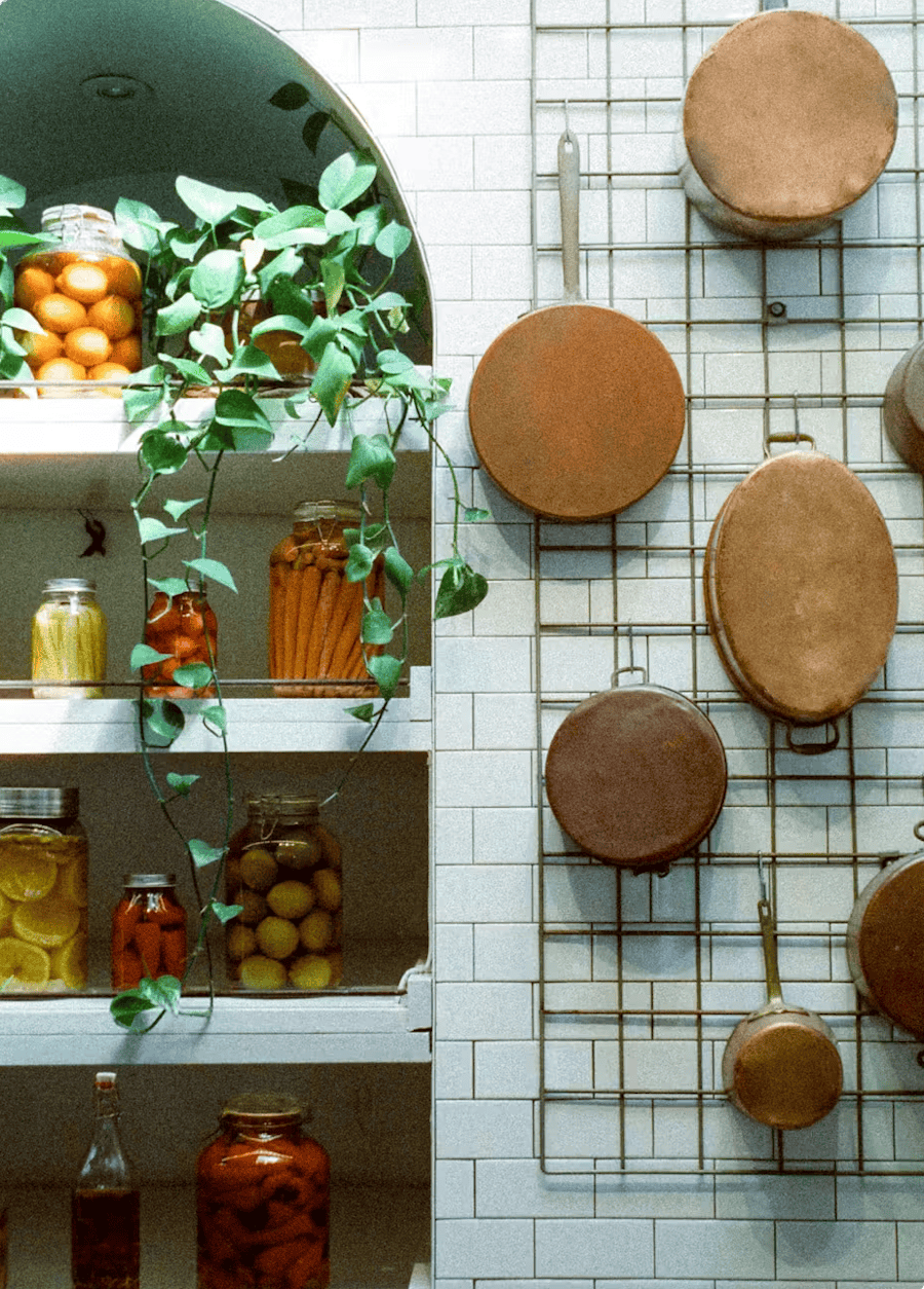 Rosemary's copper pots — the founder's family heirlooms — hanging in the kitchen.