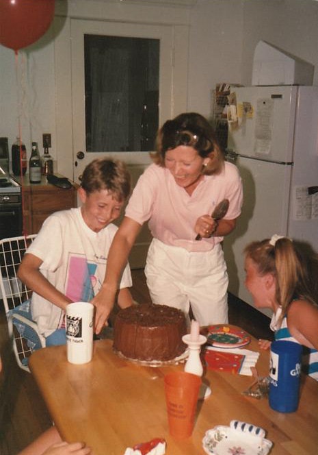 Founder Carlos Suarez with family and friends gathered around a Rosemary's table.