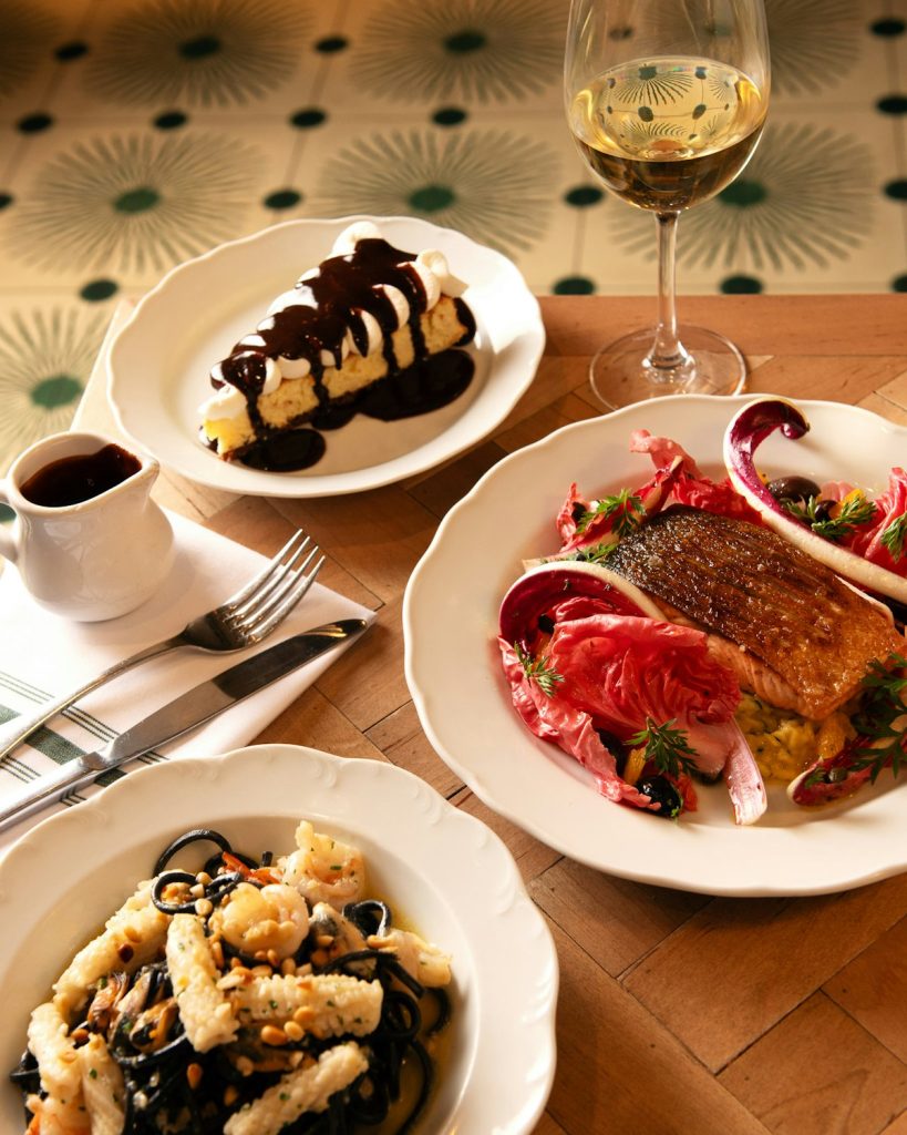 A spread of Valentine's Day dishes and drinks laid out on a table at Rosemary's